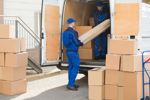 Removal team planning a move in Covent Garden near busy central London streets
